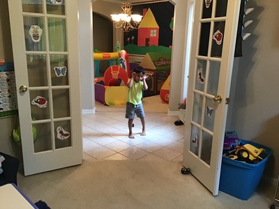 Child dancing in doorway