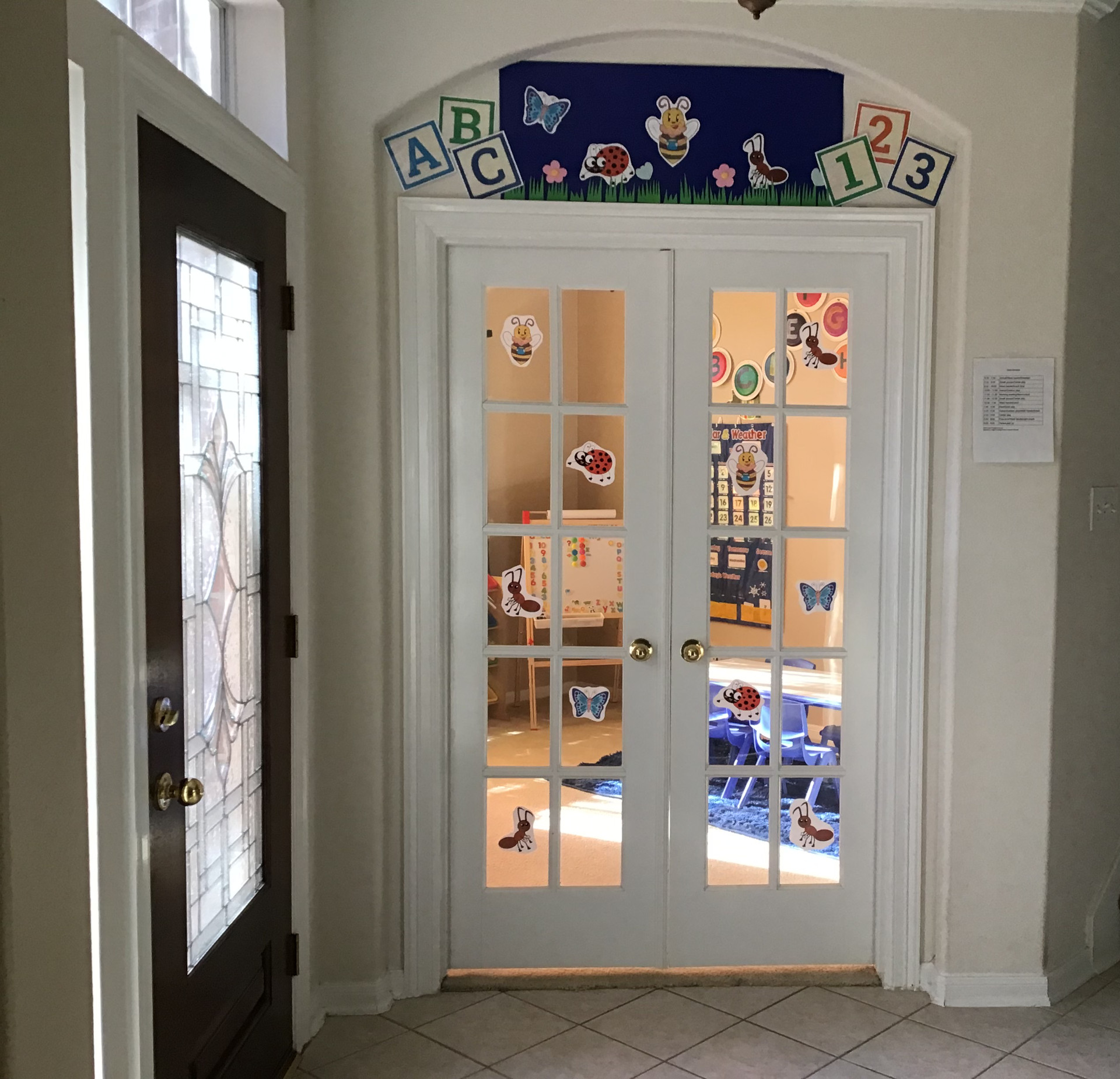 Image of a glass door of a daycare room.